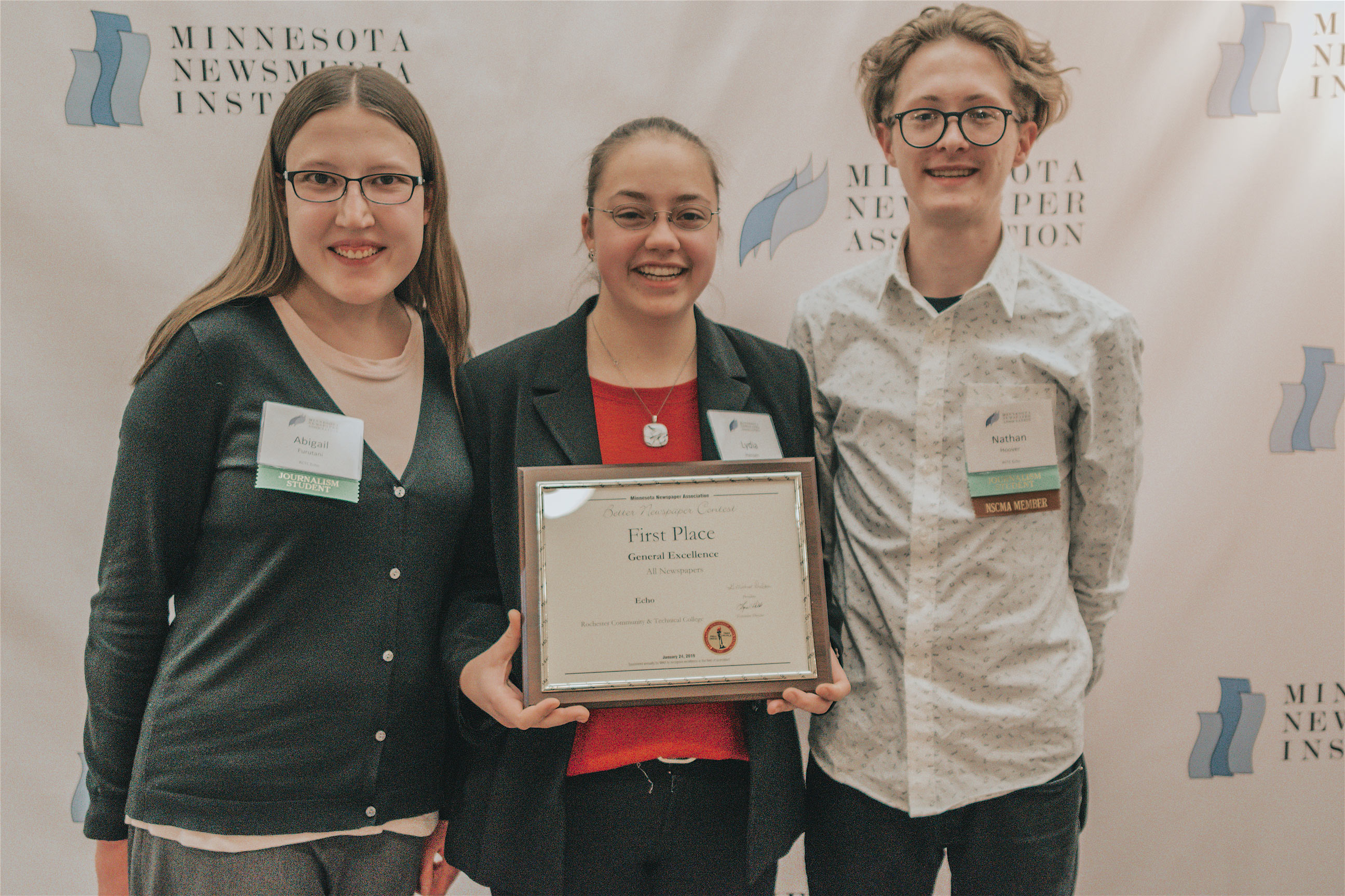 Three students with award