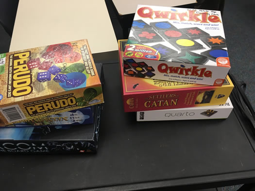 Two stacks of three board games